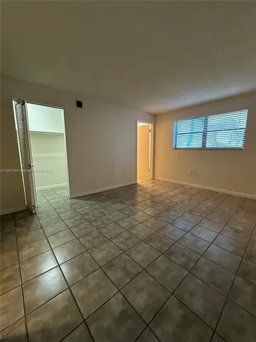 a view of an empty room and window