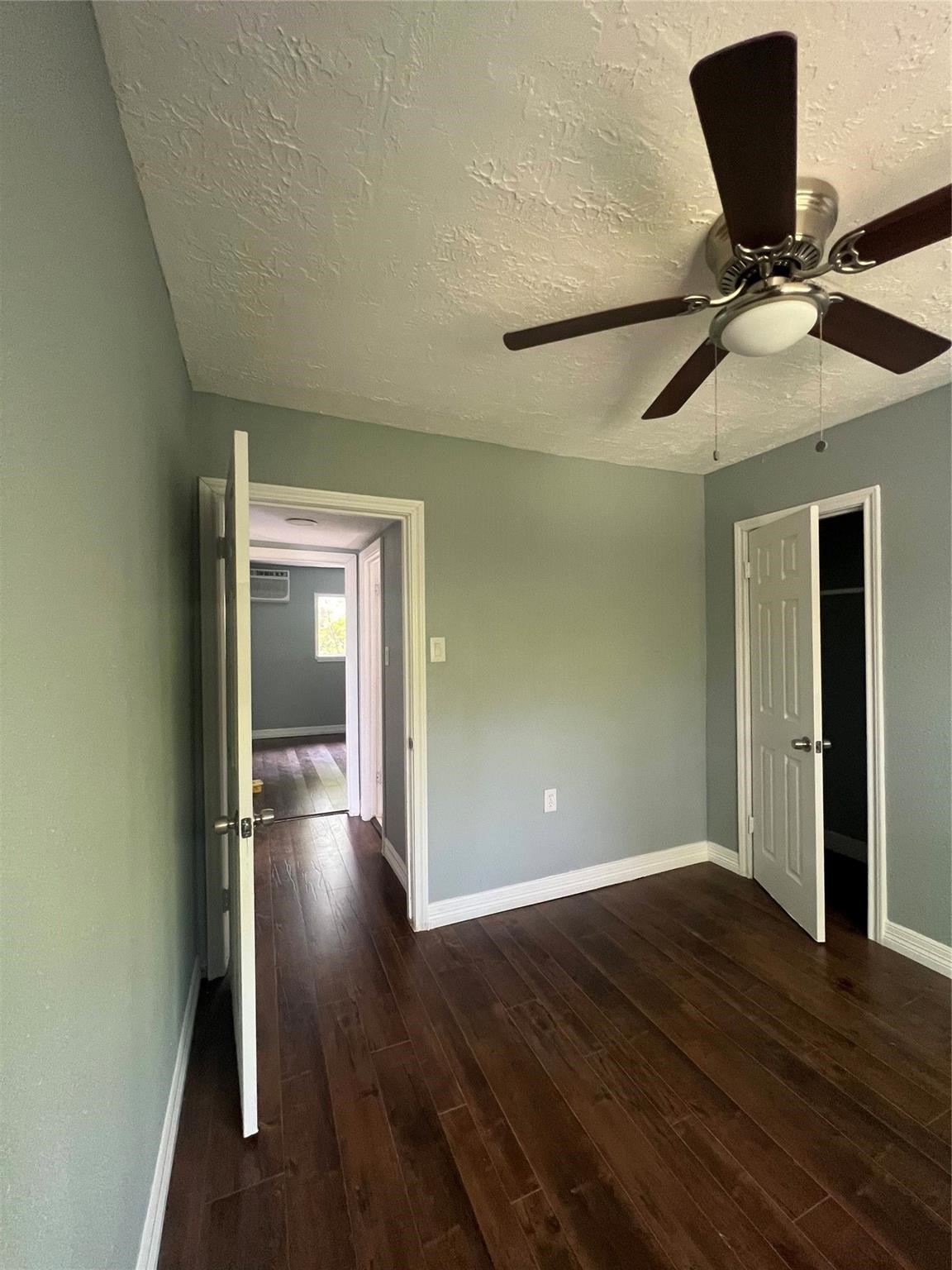 5911 Grace Lane, Unit 3 Houston, TX 77021 - Photo 6 of 7 a view of an empty room with wooden floor and a window