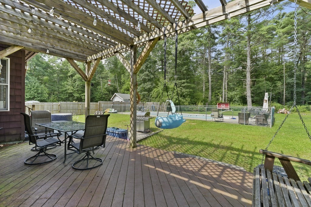 81 Beaver Lake Road Ware, MA 01082 - Photo 25 of 35 a view of a backyard with sitting area and furniture