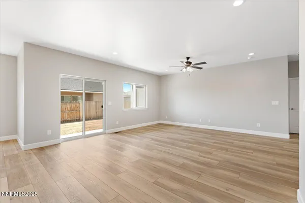 a view of a kitchen with wooden floor and cabinet
