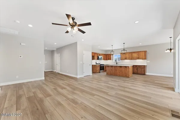 a view of a kitchen with wooden floor and cabinet