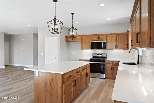 a kitchen with a table and chairs