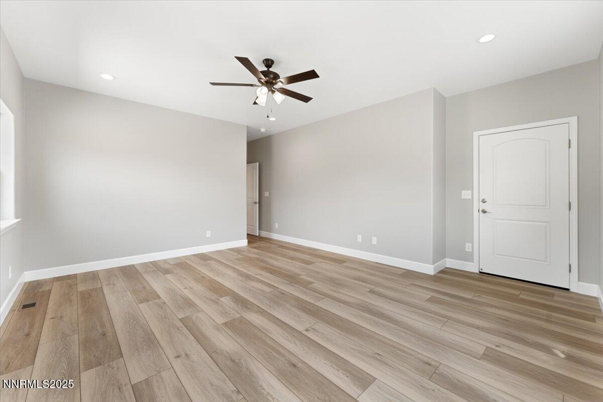 815 Great Basin Lane Fallon, NV 89406 - Photo 30 of 49 a view of an empty room with wooden floor