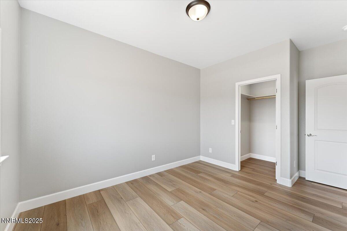 815 Great Basin Lane Fallon, NV 89406 - Photo 35 of 49 a view of room with wooden floor