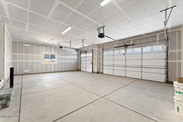 a view of empty room with white walls