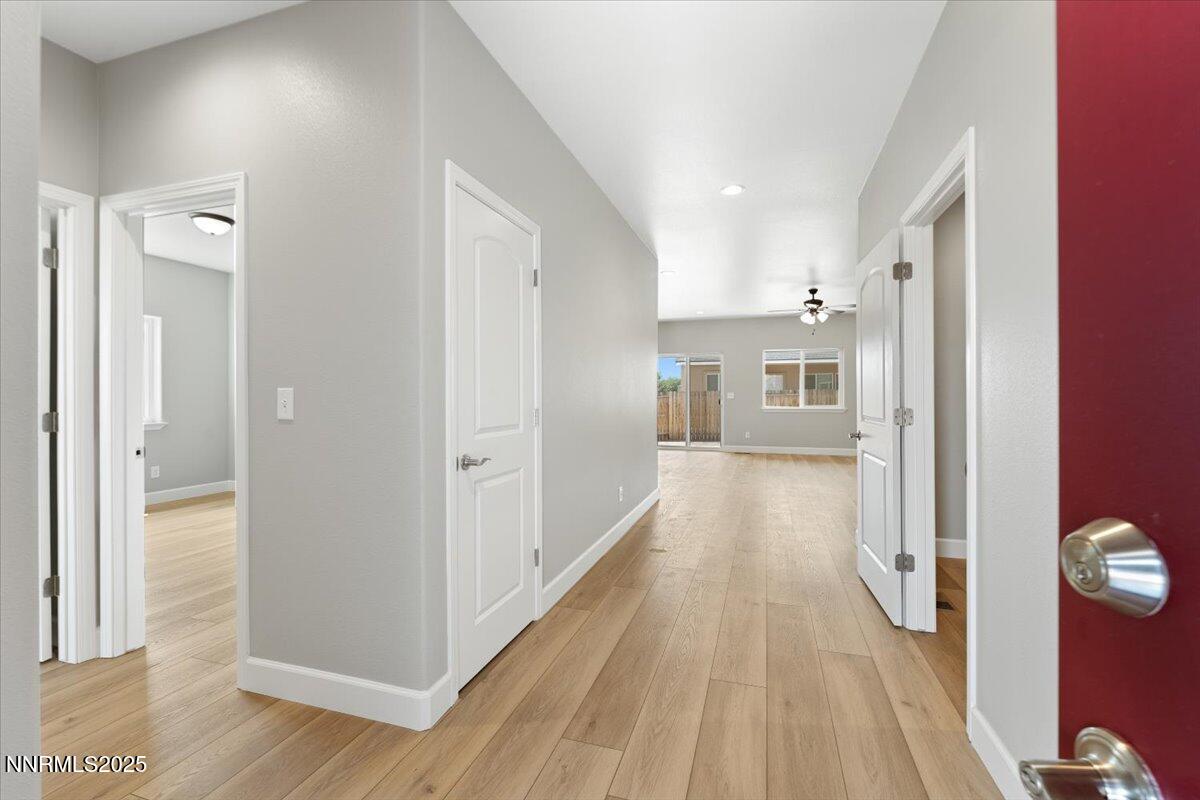 815 Great Basin Lane Fallon, NV 89406 - Photo 5 of 49 a view of a hallway with wooden floor