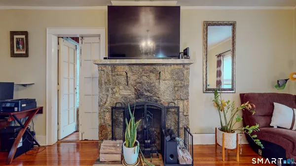 a living room with furniture and a fireplace