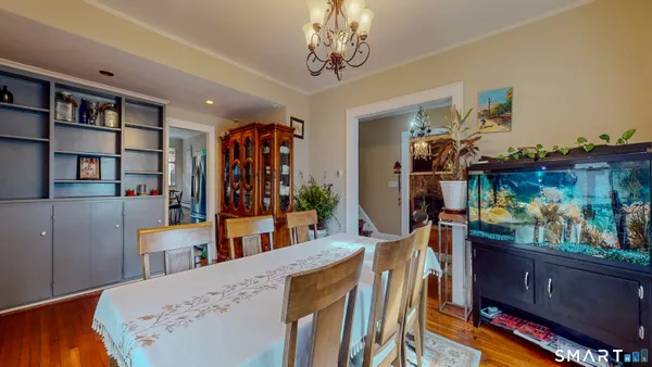 a view of a dining room with furniture and wooden floor