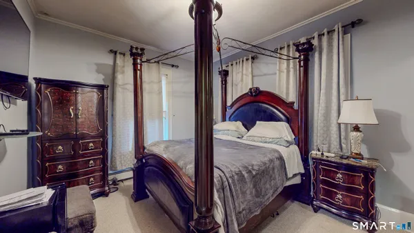 a bedroom with a bed and a closet