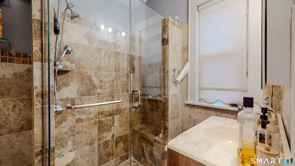 a bathroom with a sink and a shower