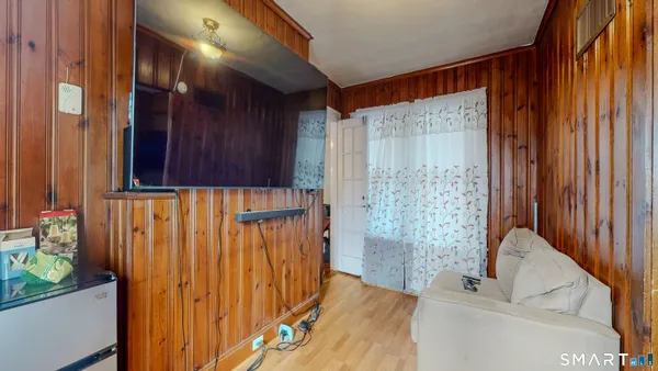 a view of a door and wooden floor