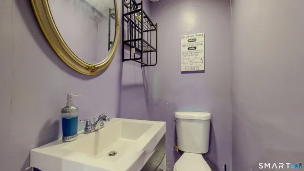 a bathroom with a toilet and a sink