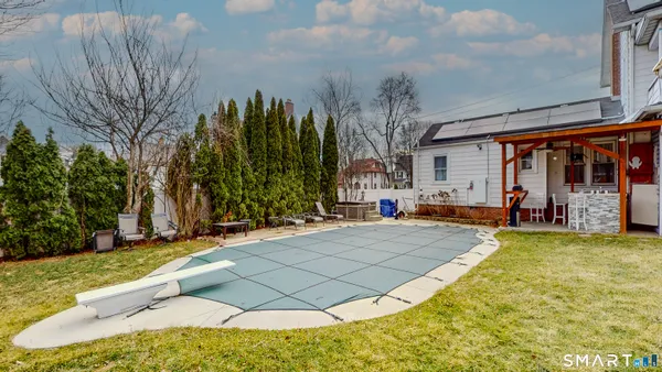 a view of house with outdoor space and sitting area