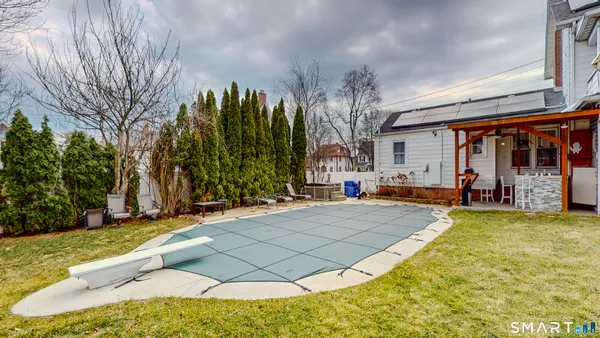 a view of a house with basketball court
