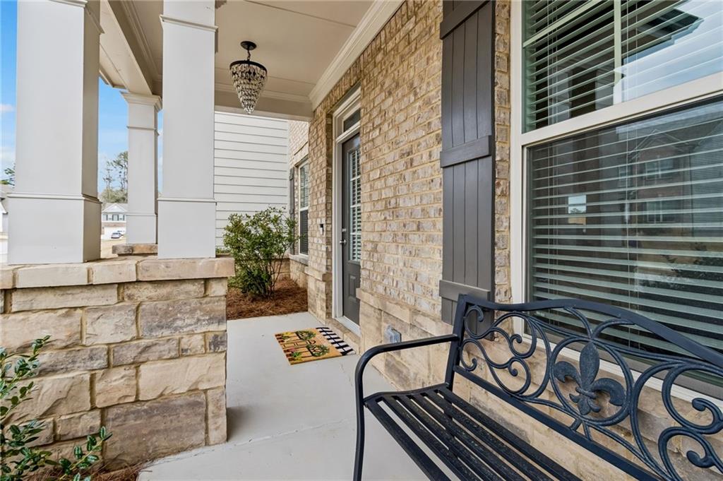 4417 Chestnut Oak Way Gainesville, GA 30504 - Photo 12 of 63 a view of balcony with two chairs and a potted plant