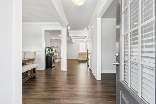 a view of an empty room and wooden floor