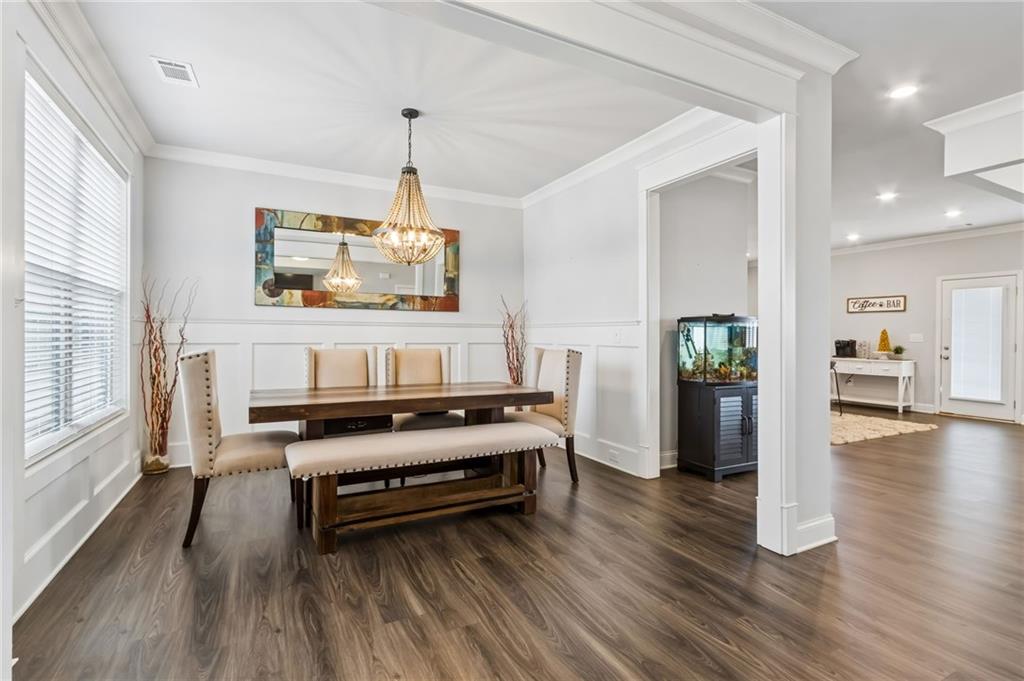 4417 Chestnut Oak Way Gainesville, GA 30504 - Photo 15 of 63 a living room with furniture and a flat screen tv