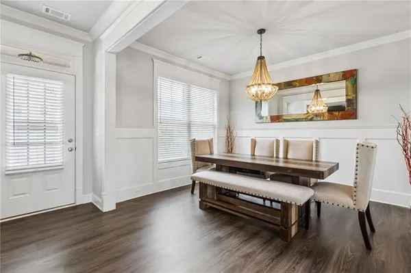 an empty room with wooden floor and window