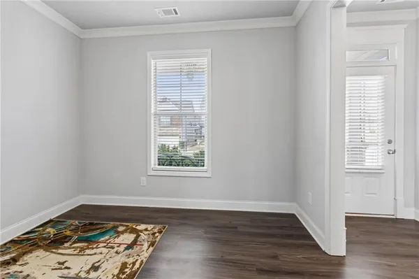 a kitchen with stainless steel appliances kitchen island granite countertop a refrigerator and a stove top oven