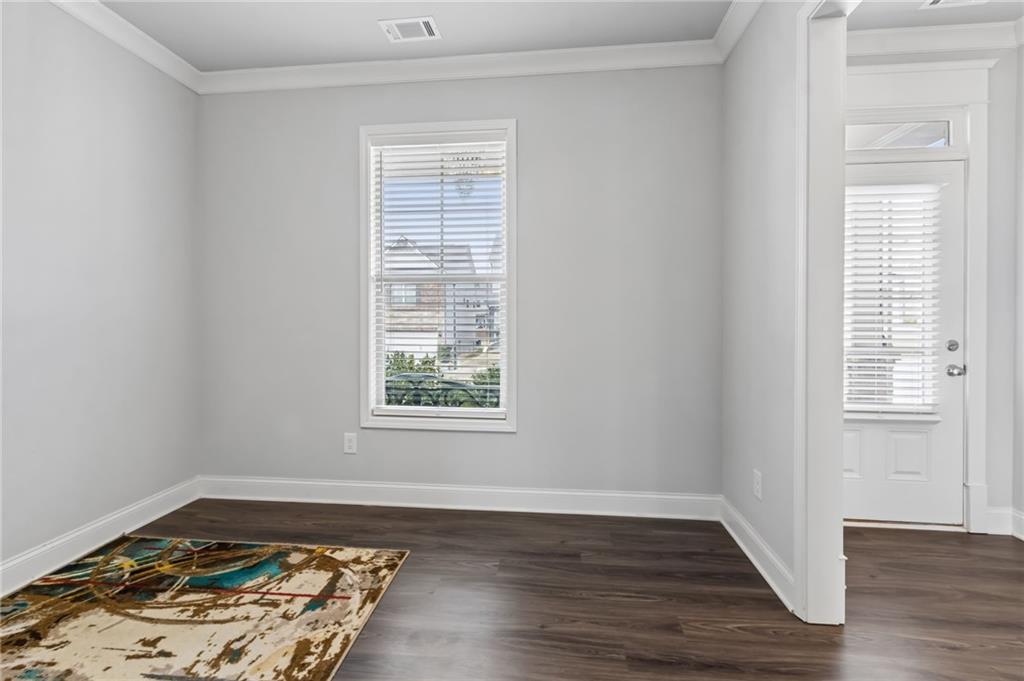 4417 Chestnut Oak Way Gainesville, GA 30504 - Photo 22 of 63 an empty room with wooden floor and window
