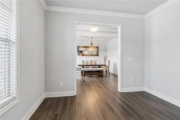 a kitchen with stainless steel appliances kitchen island granite countertop a refrigerator and a stove top oven