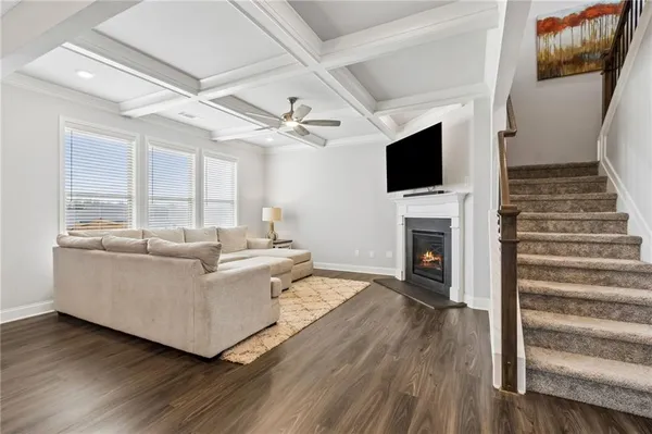 a kitchen with stainless steel appliances kitchen island granite countertop a stove a sink and a refrigerator