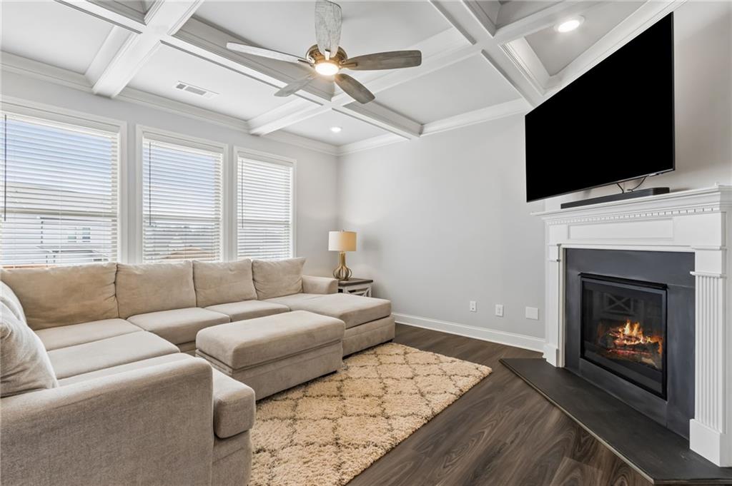 4417 Chestnut Oak Way Gainesville, GA 30504 - Photo 25 of 63 a living room with a flat screen tv and a fireplace