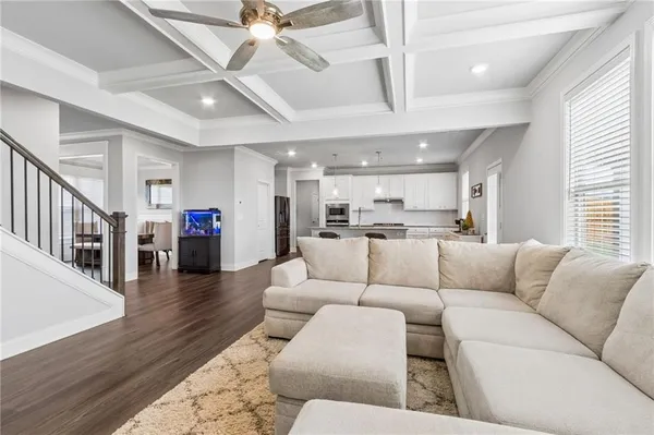 a kitchen with stainless steel appliances granite countertop a sink and a stove