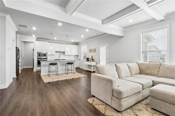 a view of kitchen with cabinets and wooden floor
