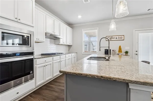 a bedroom with a bed and a flat screen tv in it
