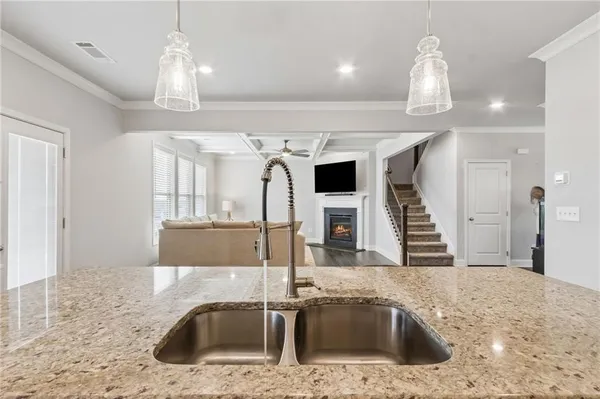 a bathroom with a shower and a sink