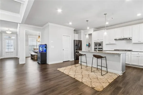 a view of walk in closet with clothes