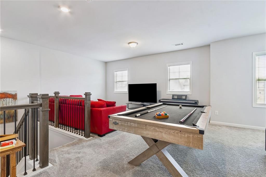 4417 Chestnut Oak Way Gainesville, GA 30504 - Photo 39 of 63 a living room with furniture pool and a window