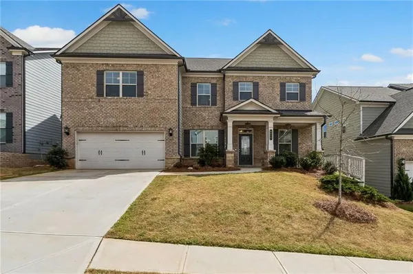 front view of a house with a yard