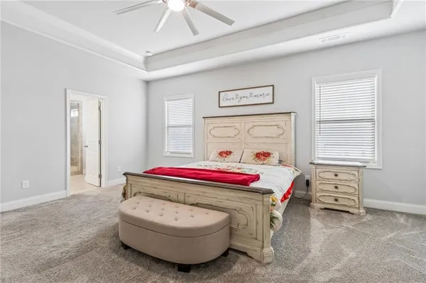 a room with a bed and a chandelier