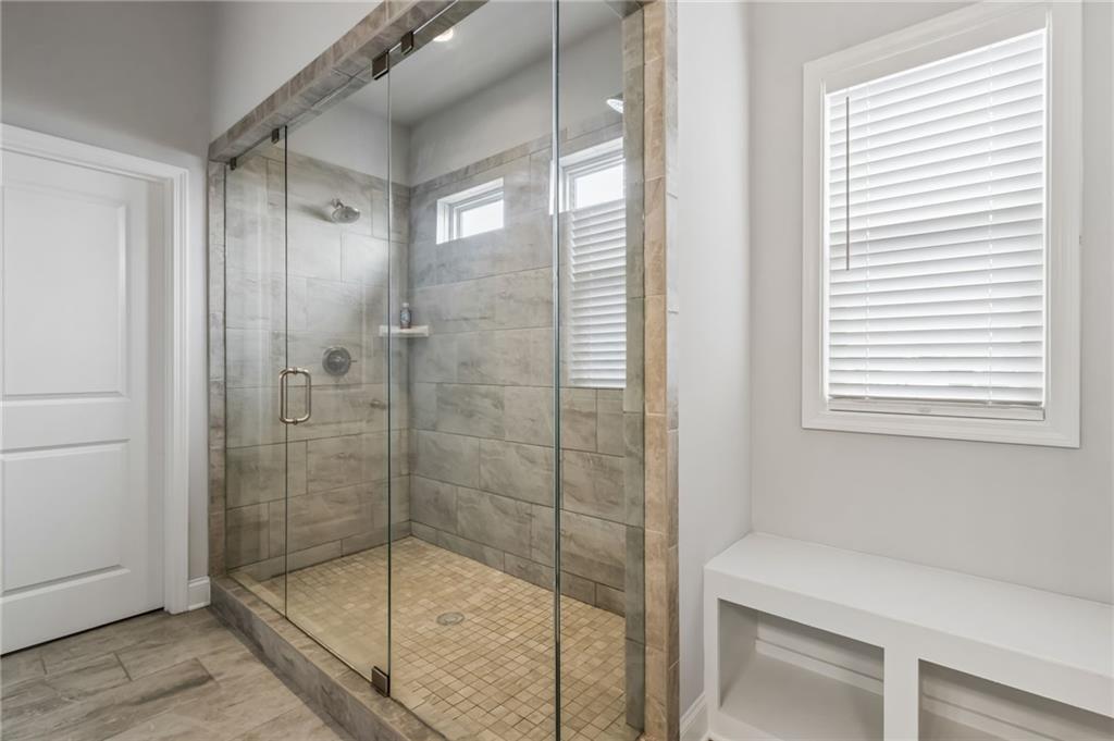 4417 Chestnut Oak Way Gainesville, GA 30504 - Photo 46 of 63 a bathroom that has a glass shower door