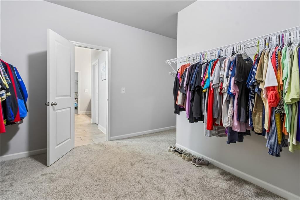 4417 Chestnut Oak Way Gainesville, GA 30504 - Photo 48 of 63 a view of walk in closet with clothes