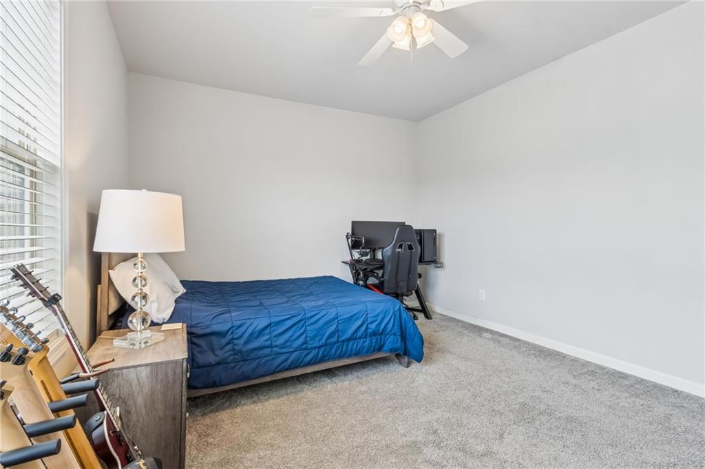 4417 Chestnut Oak Way Gainesville, GA 30504 - Photo 51 of 63 a bed room with a bed and a lamp