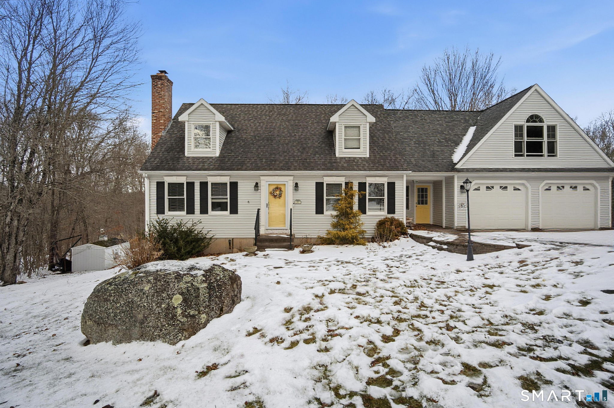 55 Stoneridge Road Colchester, CT 06415 - Photo 1 of 1 a front view of a house with a yard