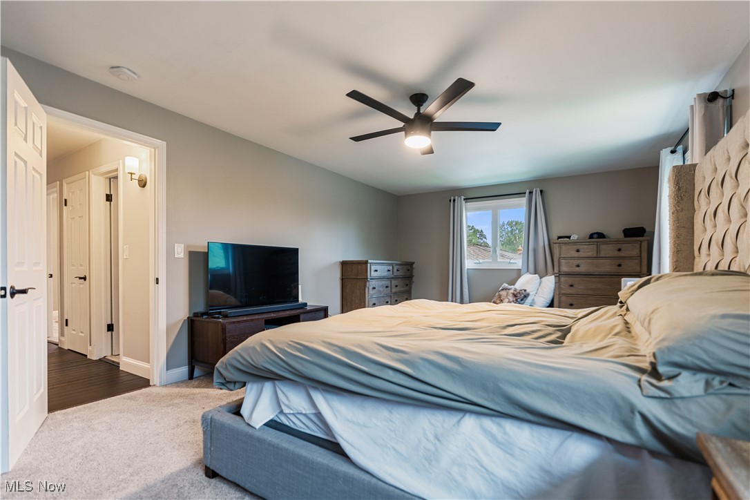 594 Long Ridge Drive Independence, OH 44131 - Photo 18 of 36 Bedroom featuring dark carpet, ceiling fan, and baseboards