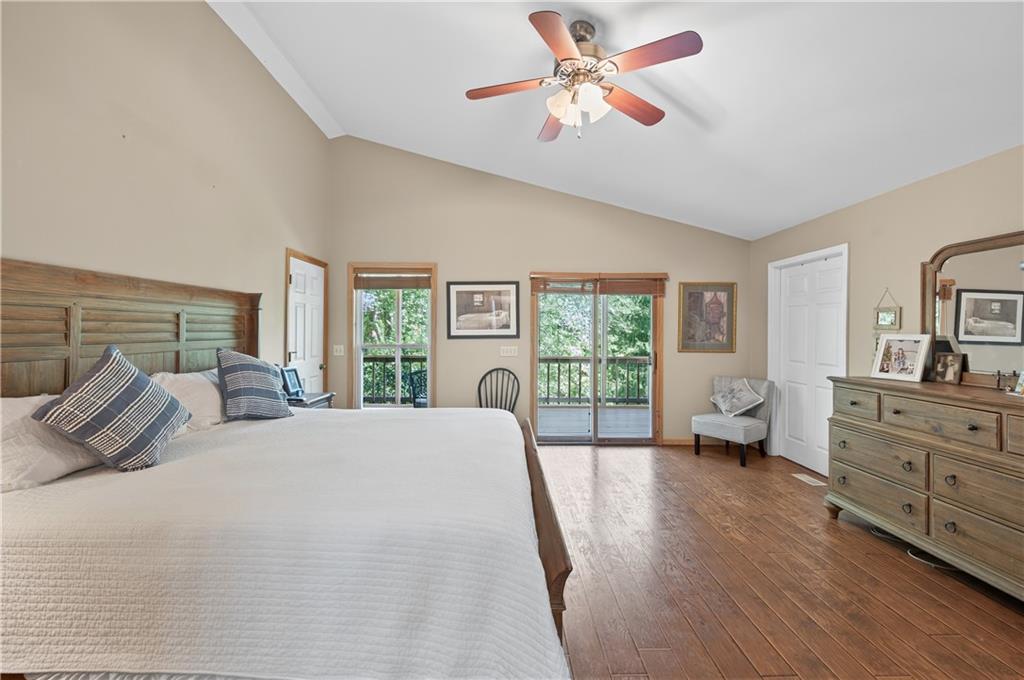 200 Bahn Innsbruck Helen, GA 30545 - Photo 15 of 27 a spacious bedroom with a bed a chandelier and a window