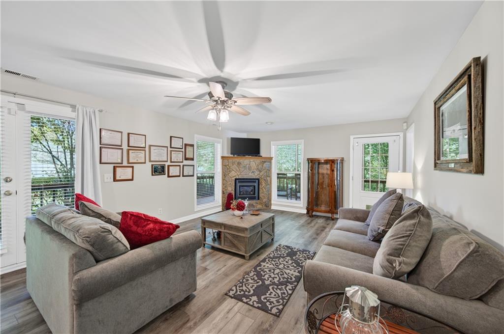 200 Bahn Innsbruck Helen, GA 30545 - Photo 17 of 27 a living room with furniture fireplace and a large window