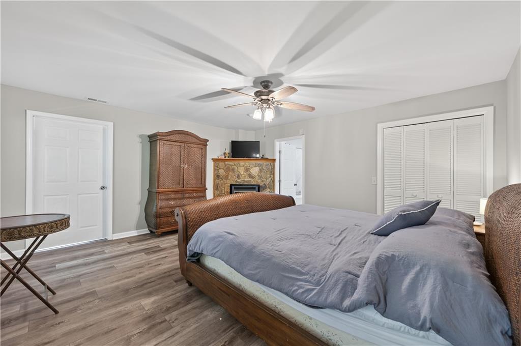 200 Bahn Innsbruck Helen, GA 30545 - Photo 19 of 27 a bedroom with a large bed a chandelier and dresser