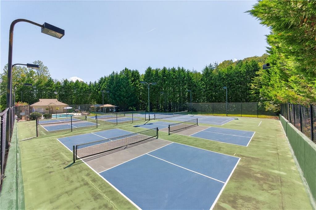 200 Bahn Innsbruck Helen, GA 30545 - Photo 5 of 27 a view of swimming pool with seating space and trees in the background