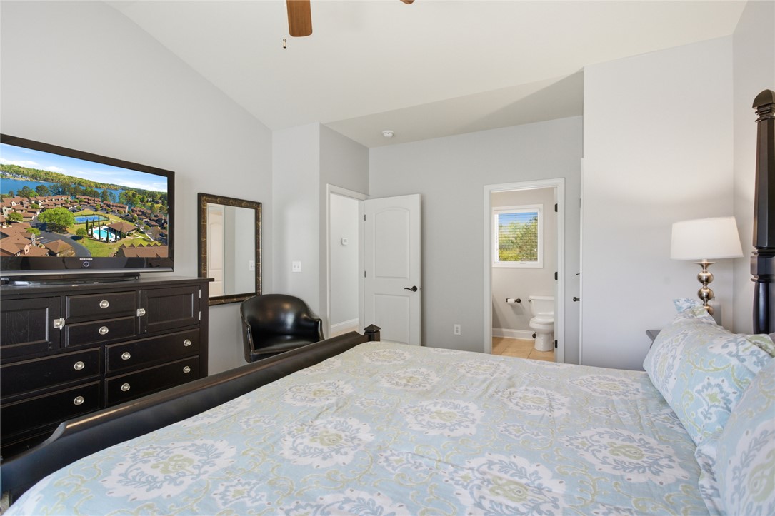 578 Sunset Point Drive West Union, SC 29696 - Photo 20 of 46 This spacious bedroom offers high ceilings and a convenient en-suite bathroom.