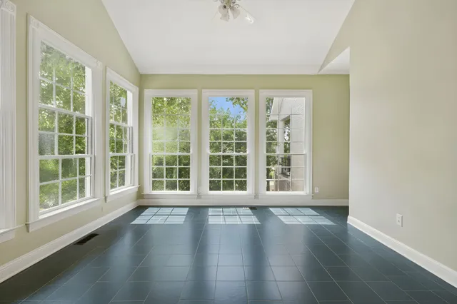 a kitchen with stainless steel appliances granite countertop a sink a stove and a wooden floors