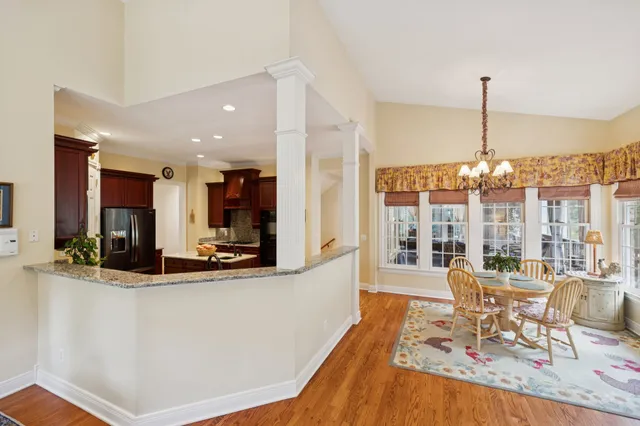 a kitchen with stainless steel appliances granite countertop a stove and a refrigerator