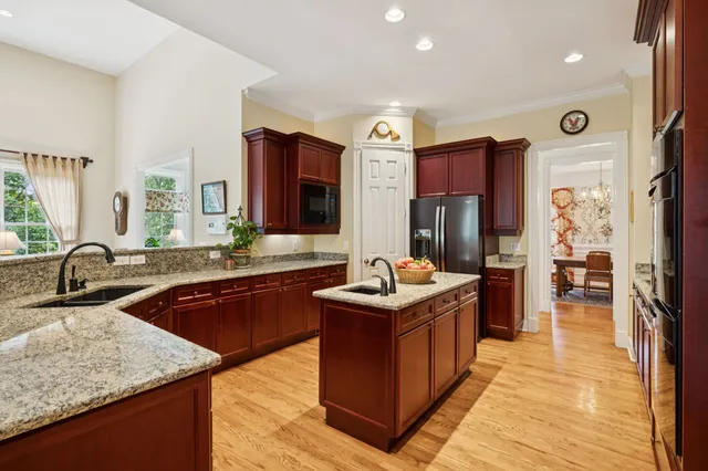 a kitchen with a sink and wooden cabinets
