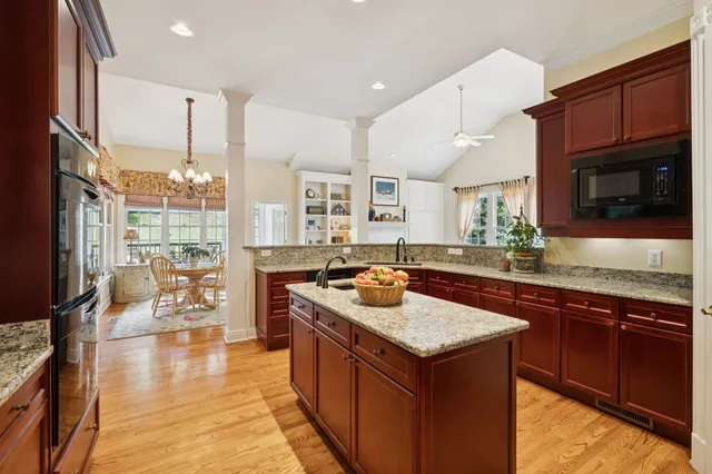 a bathroom with a toilet a sink and a mirror