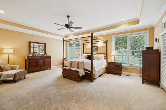 a bathroom with a tub sink and a window